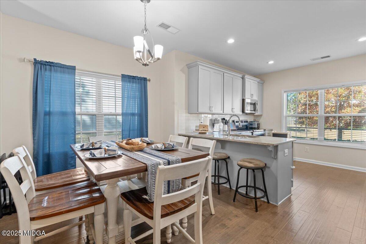 108 East E River Perry, GA 31069 - Photo 8 of 38 a view of a dining room with furniture window and wooden floor