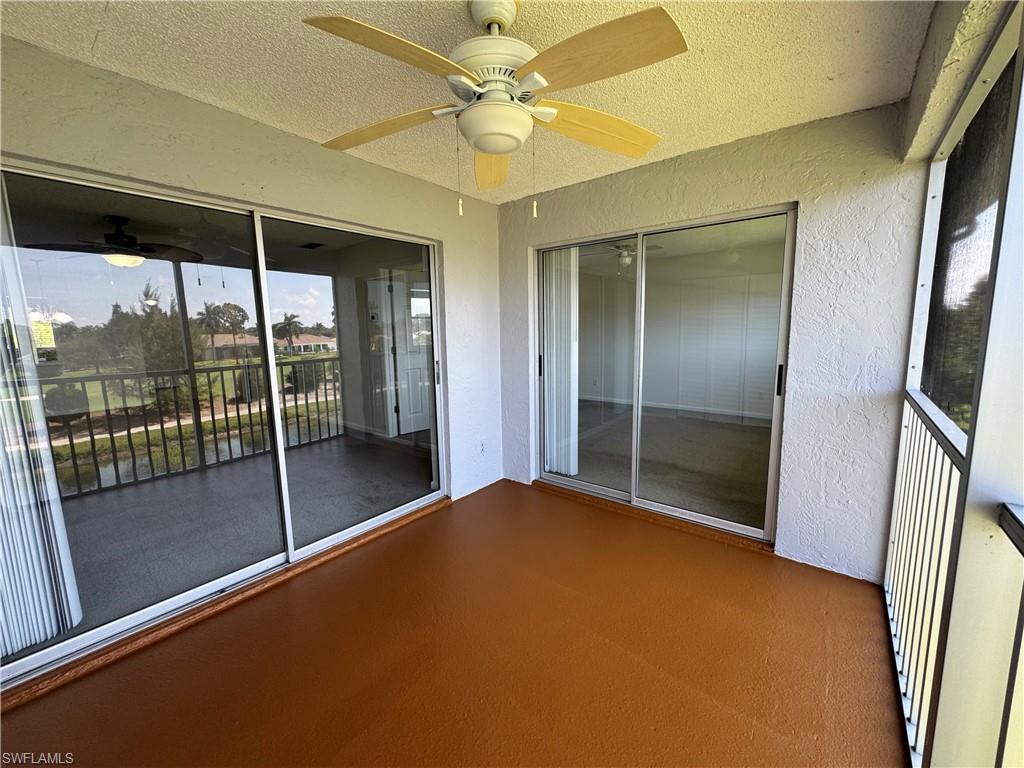 5667 Rattlesnake Hamm Road North, Unit B301 Naples, FL 34113 - Photo 17 of 17 a view of an empty room with a sliding door