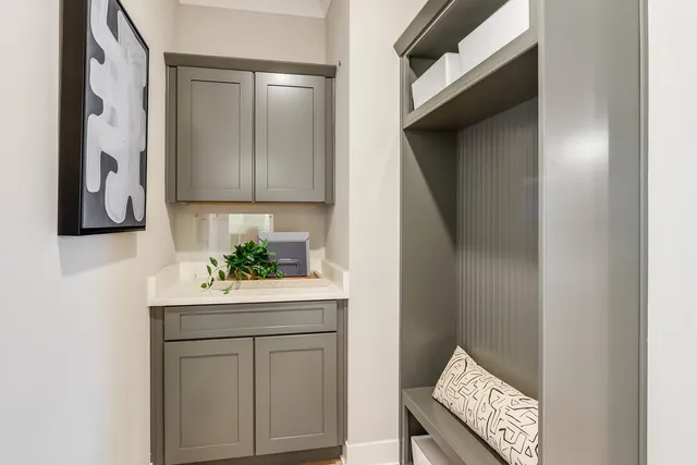 a room with a sink and a mirror