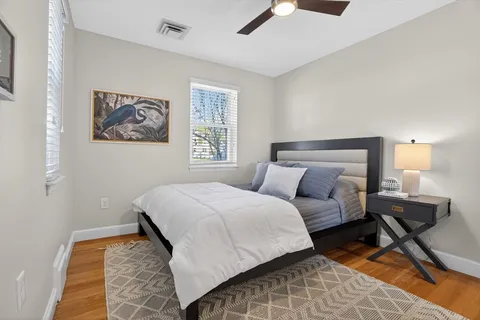 a bedroom with a bed and a lamp