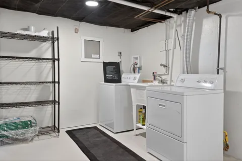 a room with a sink and a mirror