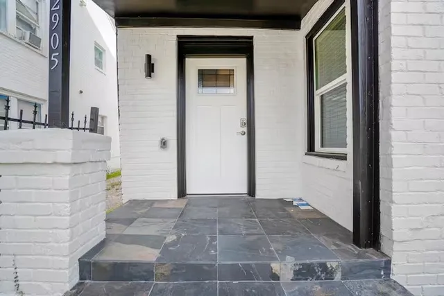 a view of a hallway with a door
