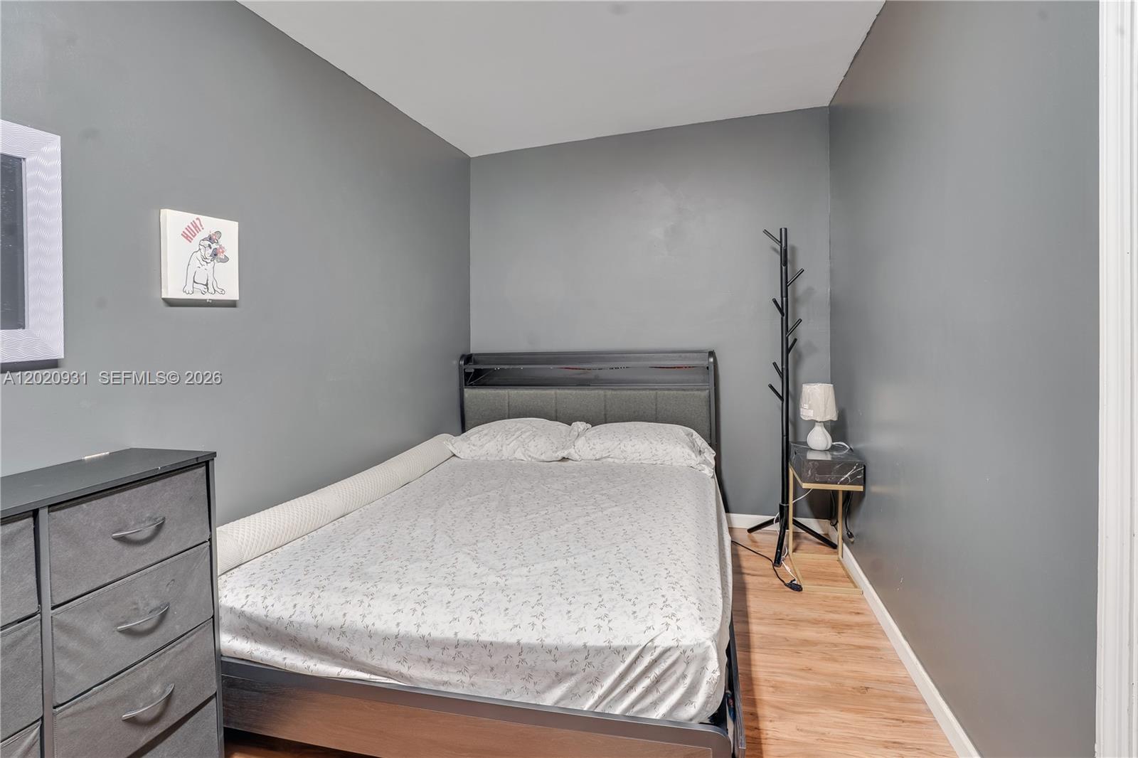 1360 Northwest 77th Street Miami, FL 33147 - Photo 24 of 41 a bedroom with a bed and a window