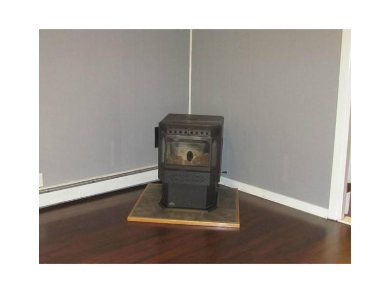 2134 Carmel Road North Newburgh, ME 04444 - Photo 11 of 32 Living Room. Pellet Stove