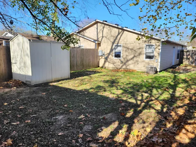 a view of backyard with garage