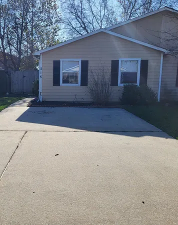 a house with trees in front of it