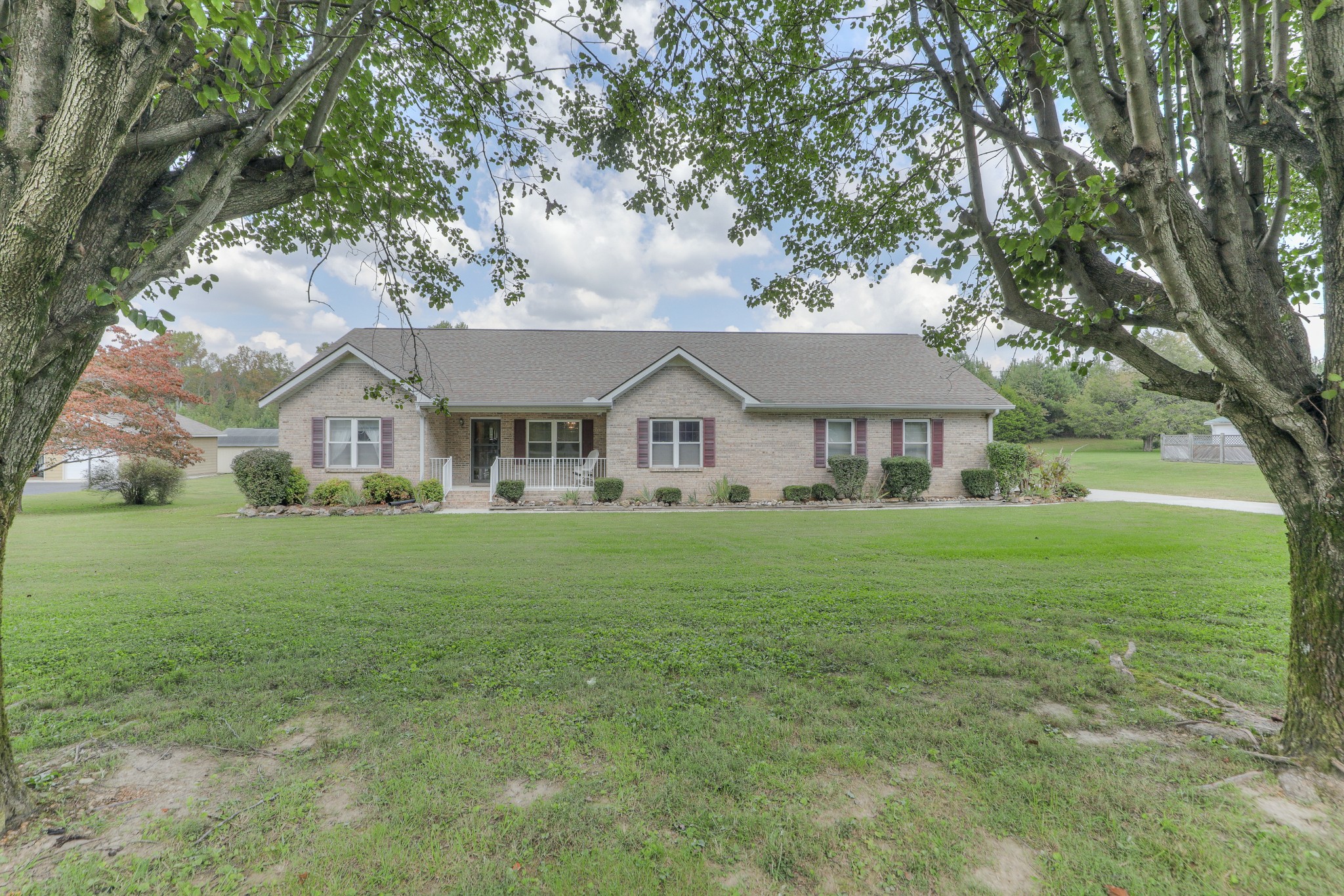 329 Shelton Road Manchester, TN 37355 - Photo 1 of 20 a view of house with garden and tall trees