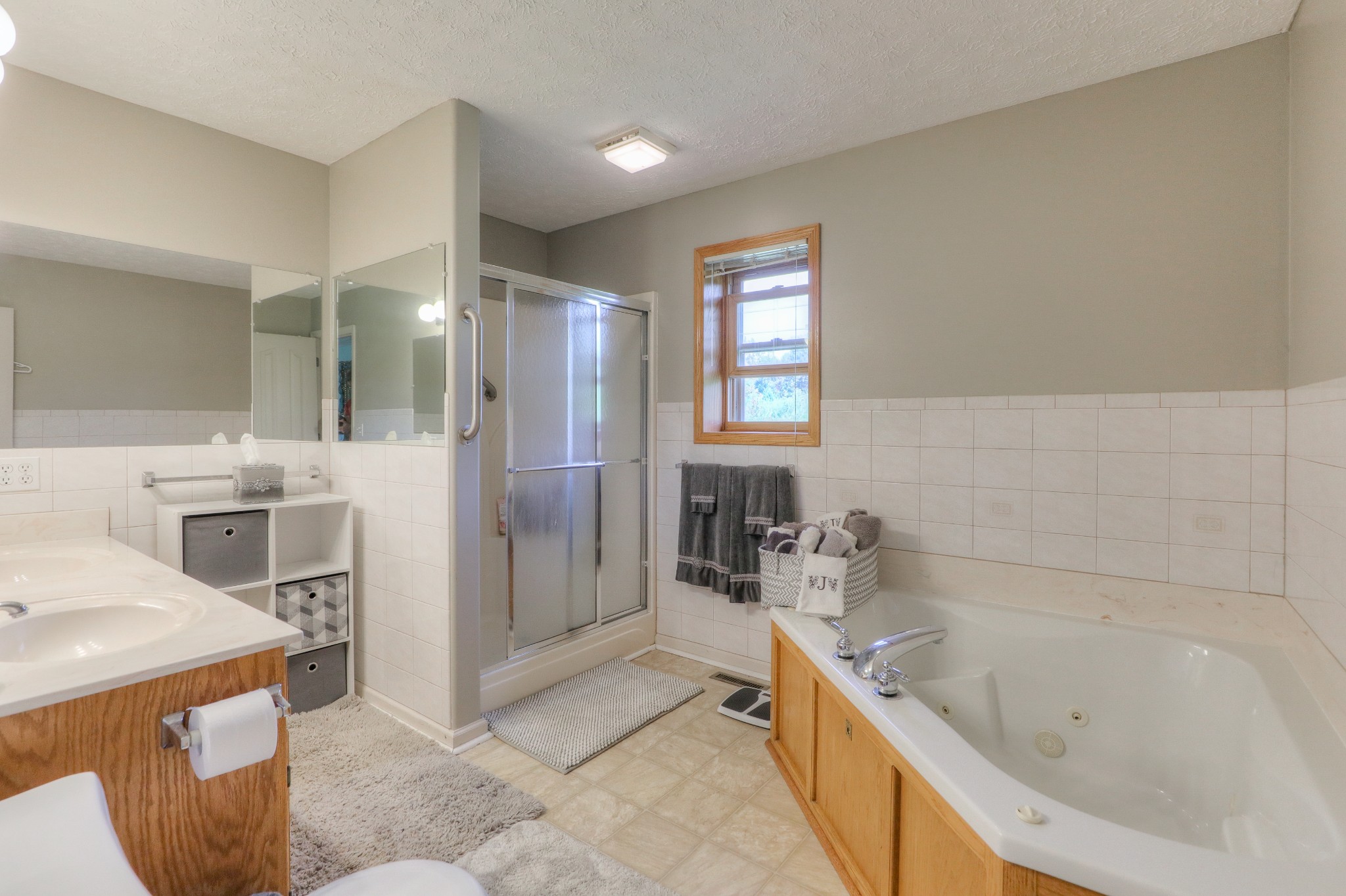 329 Shelton Road Manchester, TN 37355 - Photo 11 of 20 a bathroom with a bathtub a sink a mirror and a shower