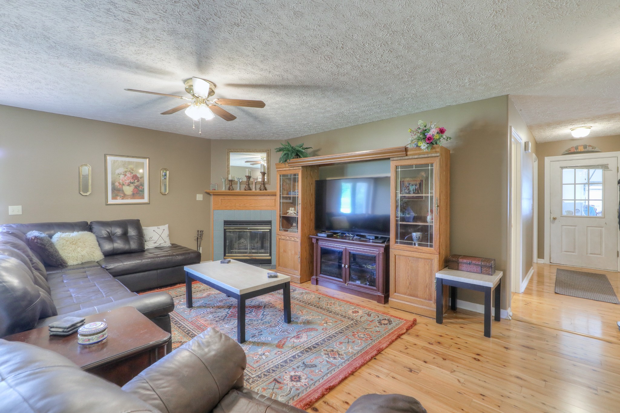 329 Shelton Road Manchester, TN 37355 - Photo 4 of 20 a living room with furniture a dining table and a fireplace