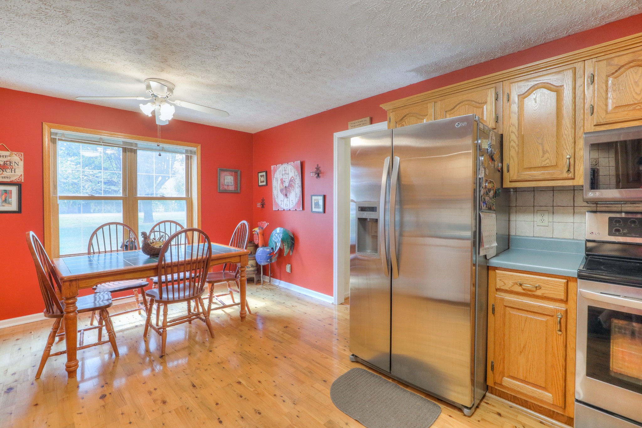 329 Shelton Road Manchester, TN 37355 - Photo 7 of 20 a dining room with furniture a chandelier and wooden floor