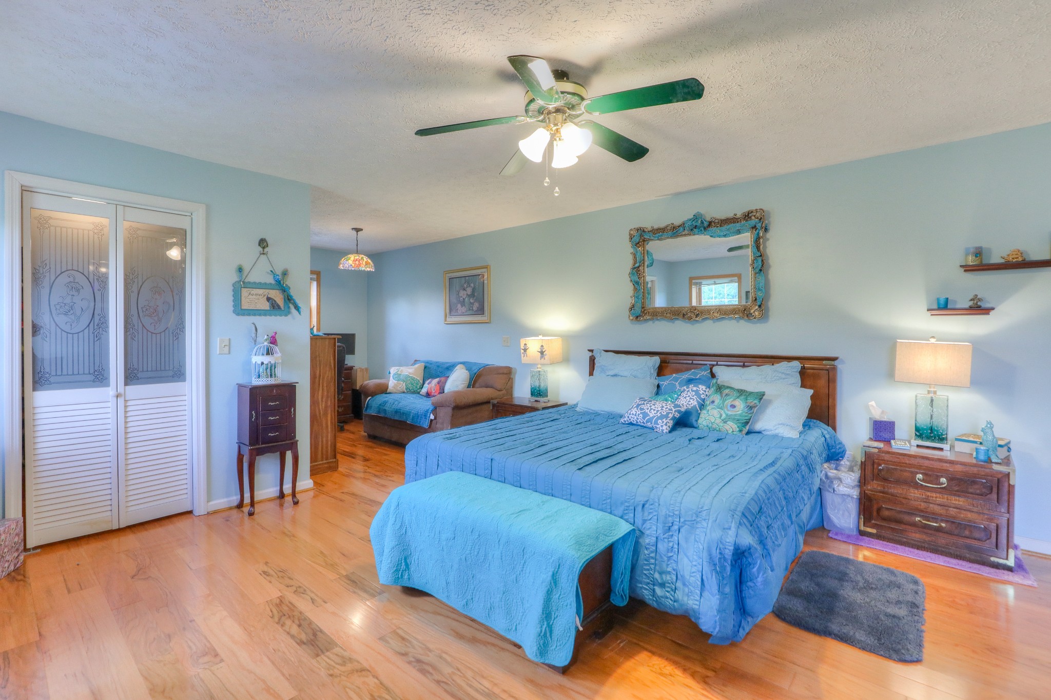 329 Shelton Road Manchester, TN 37355 - Photo 10 of 20 a bedroom with a bed and a chandelier