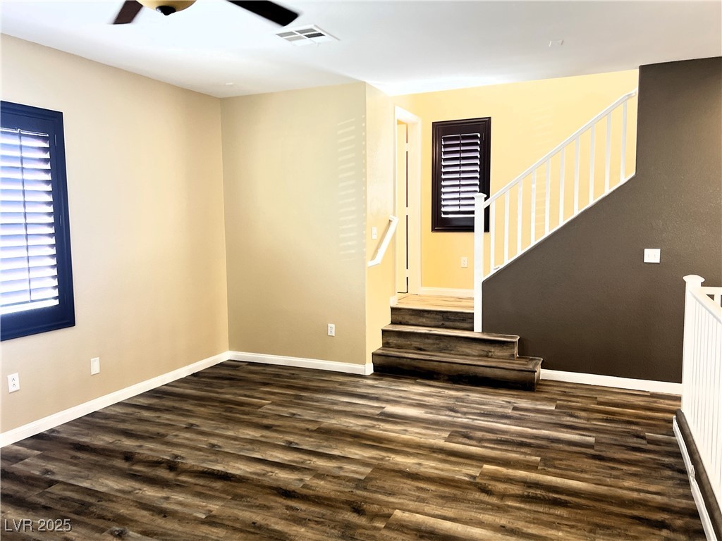 9535 Leaping Lizard Street Las Vegas, NV 89178 - Photo 11 of 37 Second floor living room with wood like LVP, ceiling fan and shutters