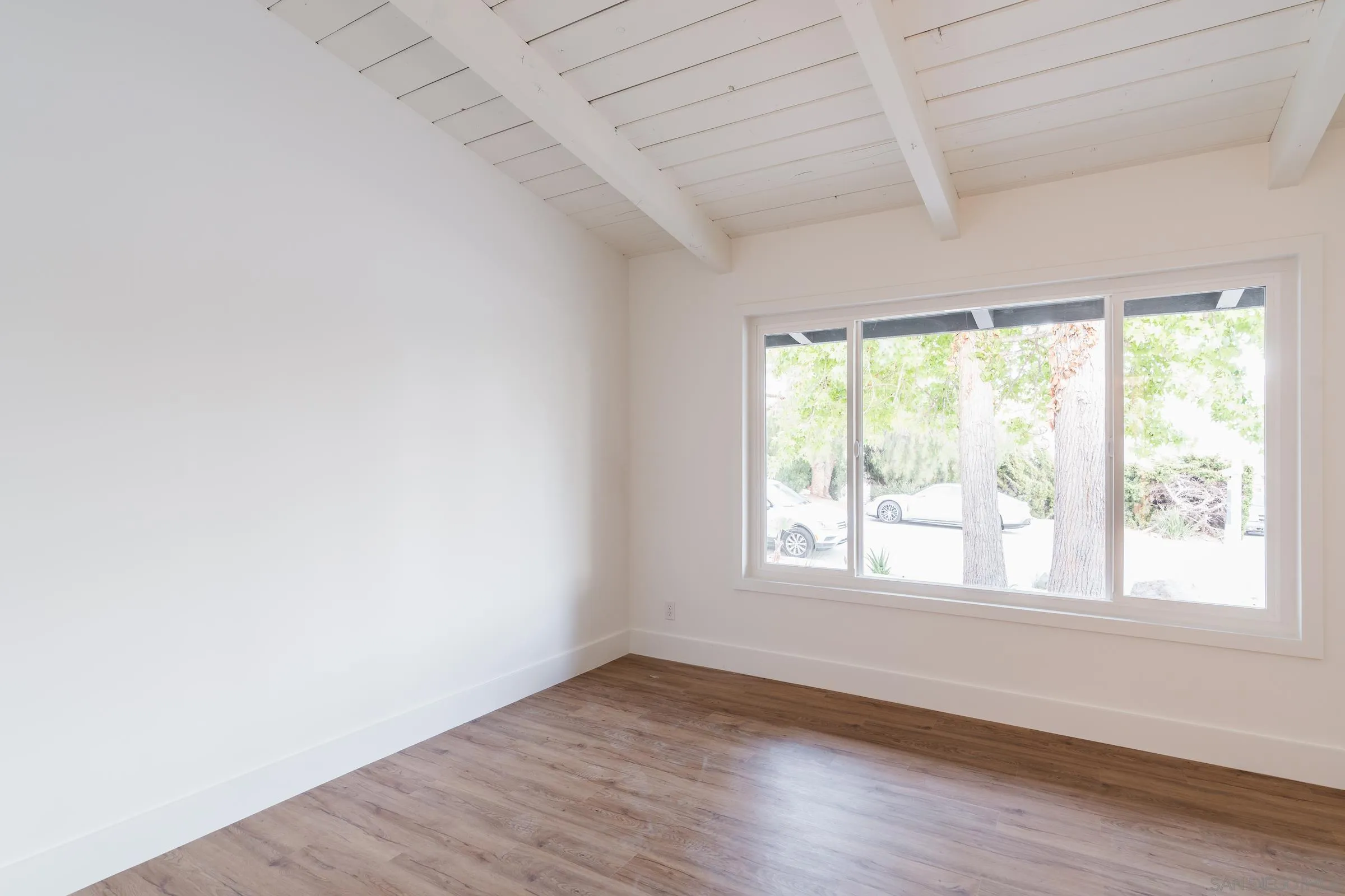 932 West Ranch Road San Marcos, CA 92078 - Photo 24 of 26 an empty room with wooden floor and windows