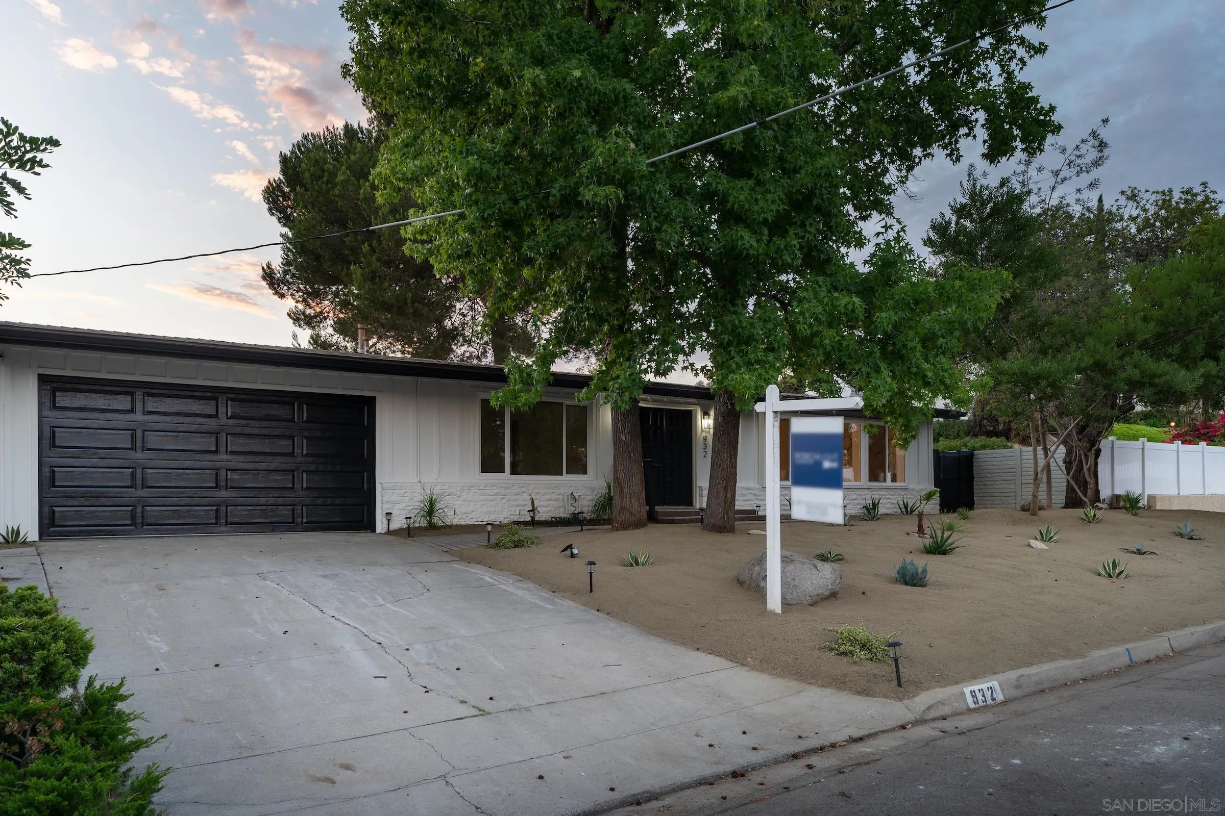 932 West Ranch Road San Marcos, CA 92078 - Photo 25 of 26 a backyard of a house with garage and large trees