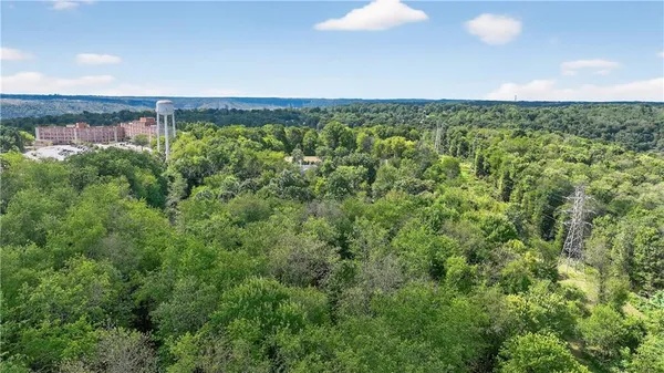 a view of a yard from a balcony