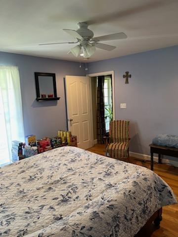 1328 Maddox Road Centerville, TN 37033 - Photo 14 of 47 a bedroom with a bed and a chandelier