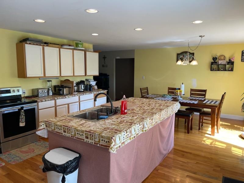 1328 Maddox Road Centerville, TN 37033 - Photo 8 of 47 a kitchen with kitchen island granite countertop a sink and stove