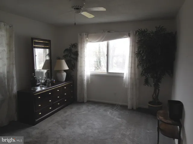 a room with window and furniture