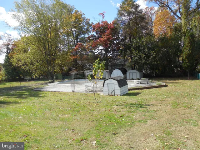 a big yard with large trees