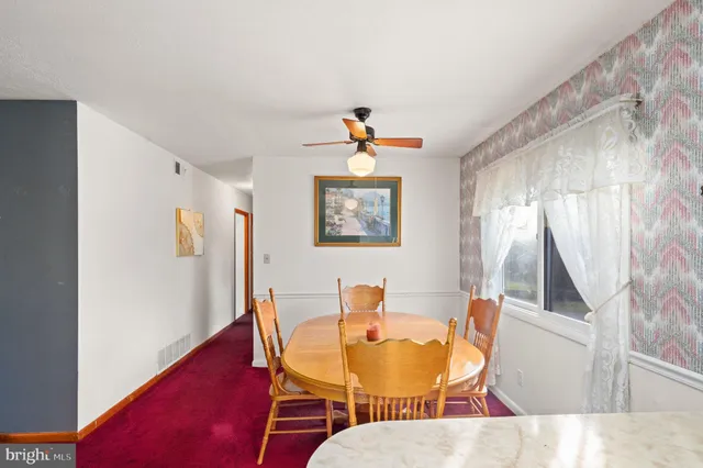 a bathroom with a double vanity sink toilet and a mirror