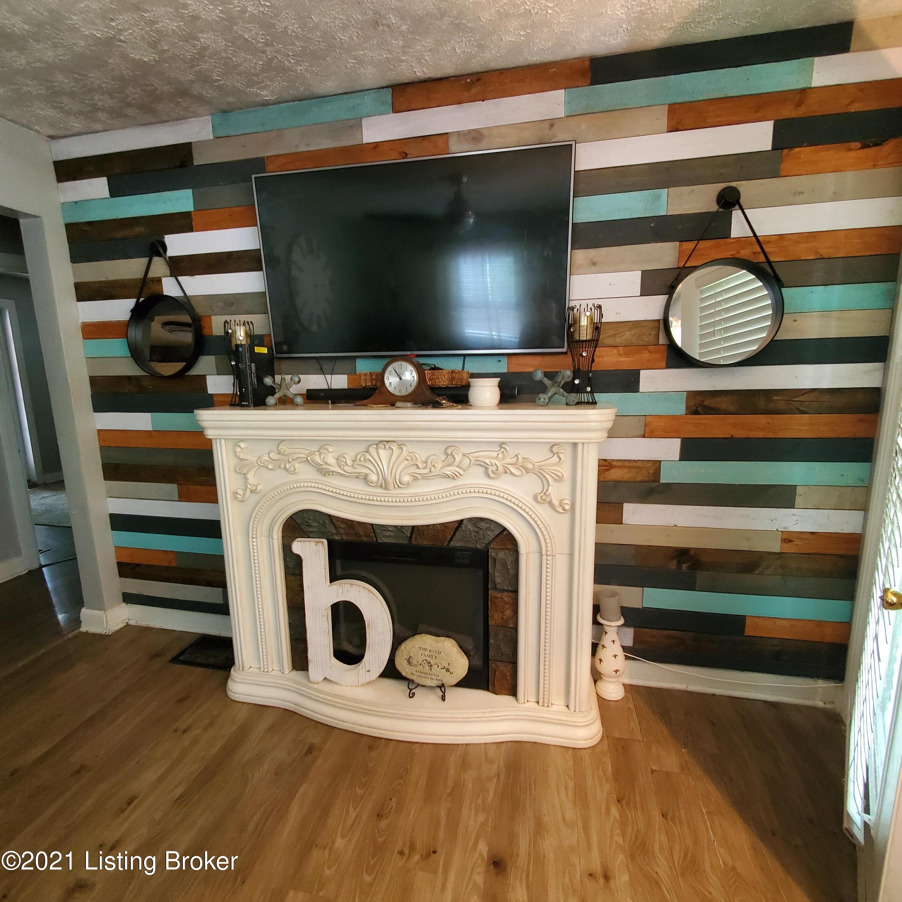 4715 Dohn Road Louisville, KY 40216 - Photo 6 of 14 Living room accent wall with trendy shiplap decor