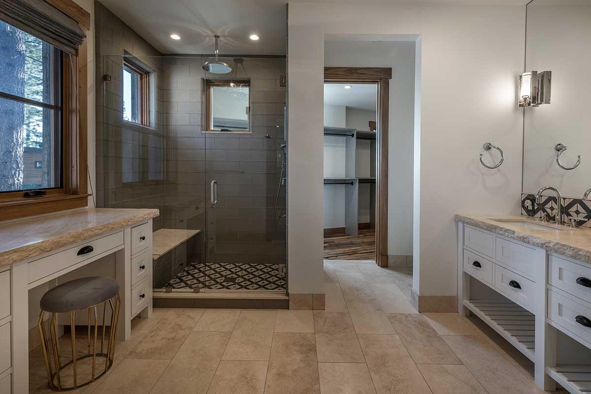 8249 Ehrman Drive Truckee, CA 96161 - Photo 11 of 21 a bathroom with a double vanity sink a toilet and shower
