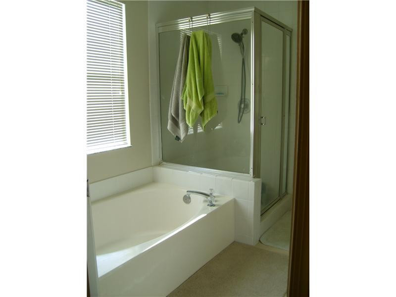 23314 Sunview Way Boca Raton, FL 33428 - Photo 14 of 24 a bathroom with a bathtub and a shower
