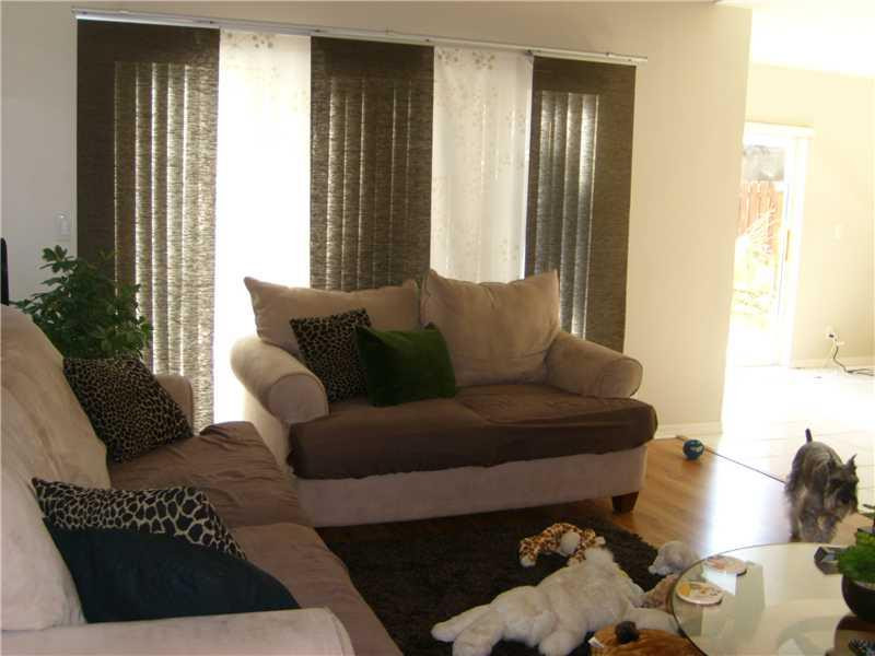 23314 Sunview Way Boca Raton, FL 33428 - Photo 8 of 24 a living room with furniture and a window