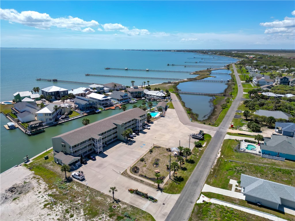 2290 North Fulton Beach Road, Unit 214 Rockport, TX 78382 - Photo 16 of 29 an aerial view of a house with yard swimming pool and outdoor seating