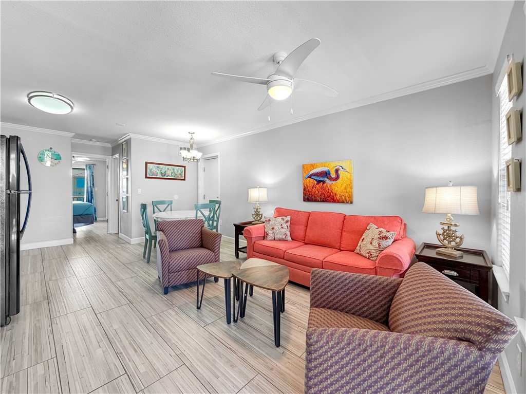 2290 North Fulton Beach Road, Unit 214 Rockport, TX 78382 - Photo 19 of 29 a living room with furniture and wooden floor