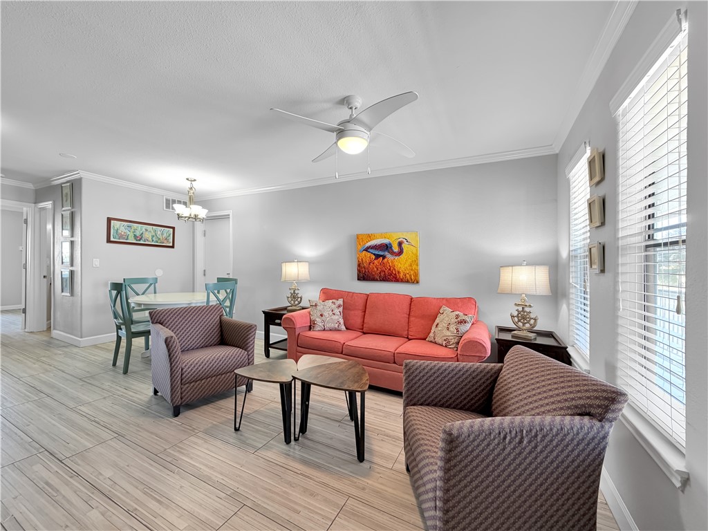 2290 North Fulton Beach Road, Unit 214 Rockport, TX 78382 - Photo 20 of 29 a living room with furniture and a wooden floor