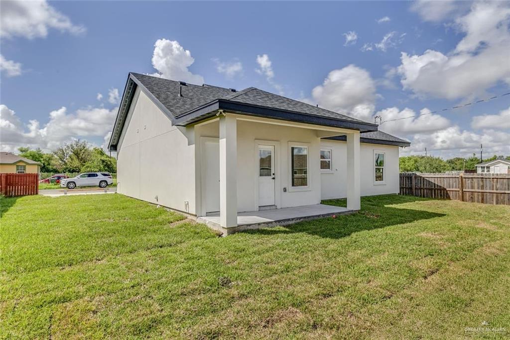910 Trinity Street Alamo, TX 78516 - Photo 12 of 12 a view of a backyard with plants and a patio