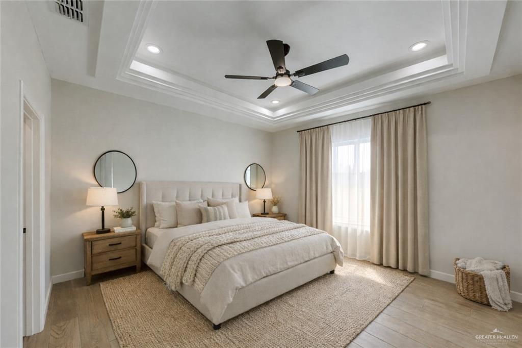 910 Trinity Street Alamo, TX 78516 - Photo 5 of 12 a bedroom with a bed and window