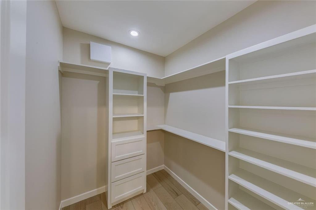 910 Trinity Street Alamo, TX 78516 - Photo 9 of 12 a view of walk in closet with empty racks