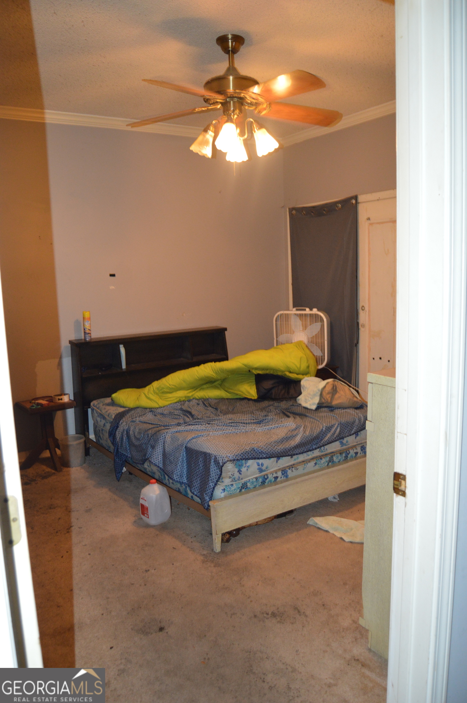 424 Law House Road Toccoa, GA 30577 - Photo 12 of 38 a bedroom with a bed and a chandelier