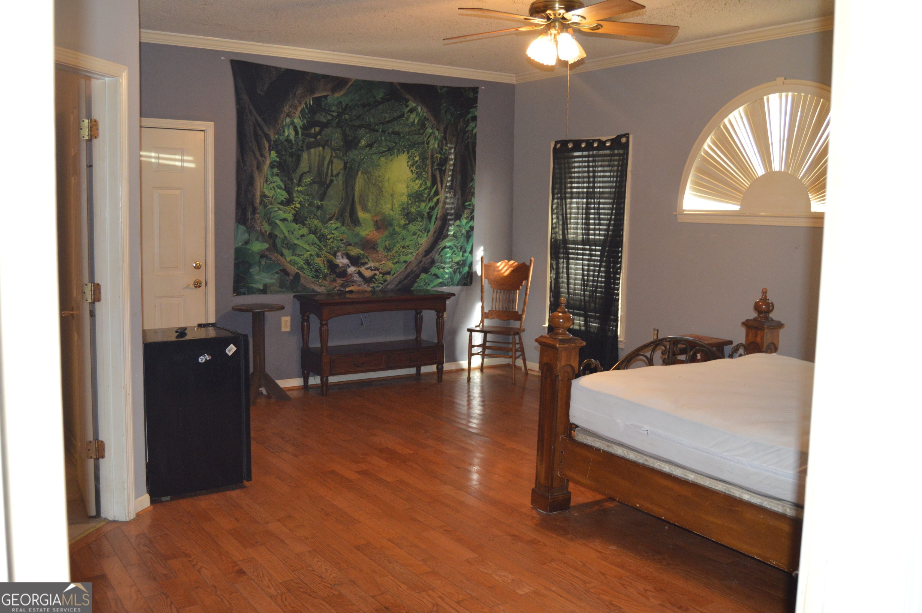424 Law House Road Toccoa, GA 30577 - Photo 26 of 38 a bedroom with a bed window and a mirror
