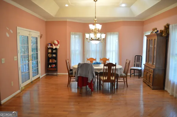 a view of a dining room with furniture window and outside view