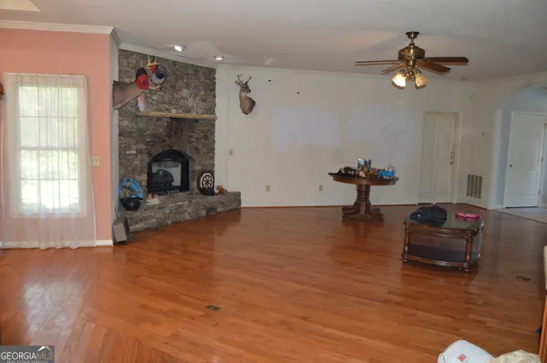 a living room with furniture and a fireplace