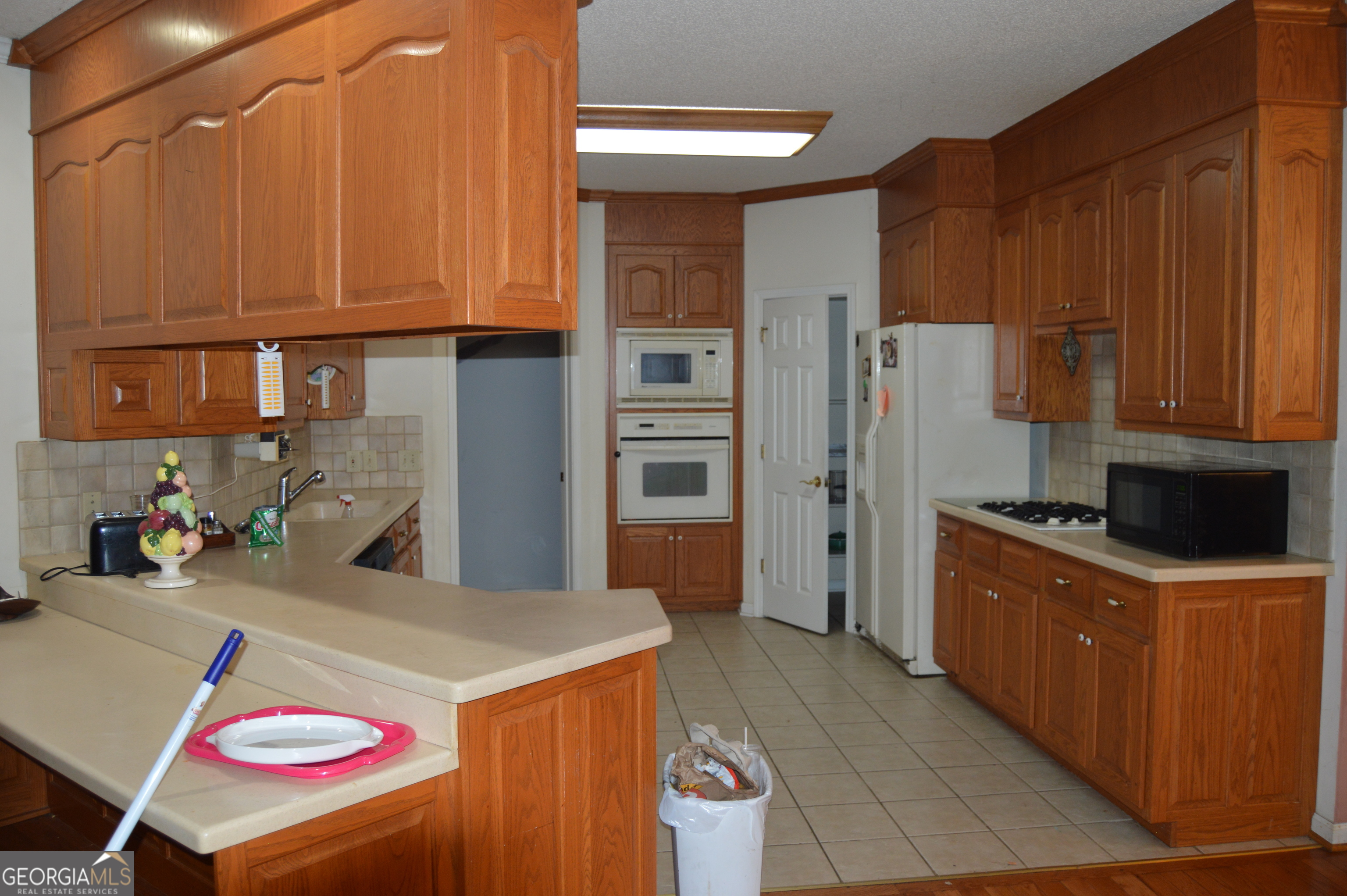 424 Law House Road Toccoa, GA 30577 - Photo 9 of 38 a kitchen with stainless steel appliances granite countertop a refrigerator stove and sink
