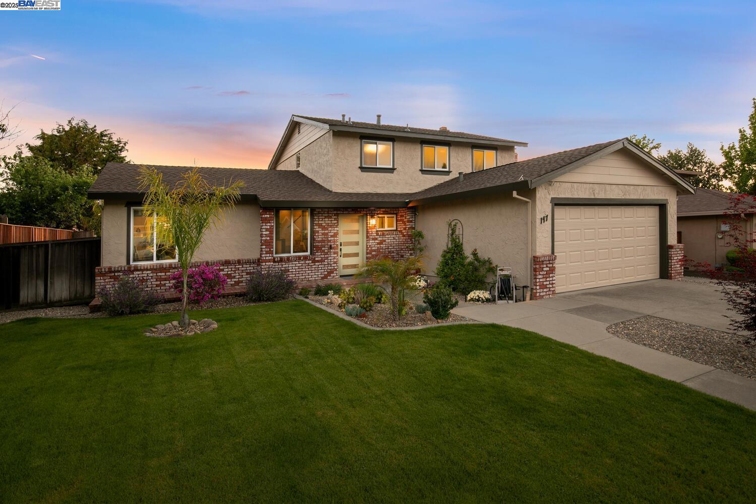 147 Stanmore Circle Vallejo, CA 94591 - Photo 1 of 1 a front view of a house with a garden and yard