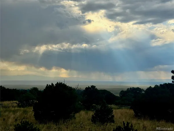 a view of lake with green space