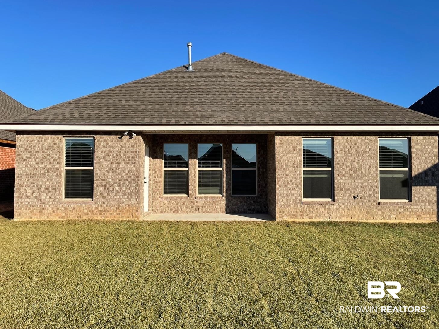 1403 Fenton Circle Foley, AL 36535 - Photo 13 of 15 Back of house with a yard