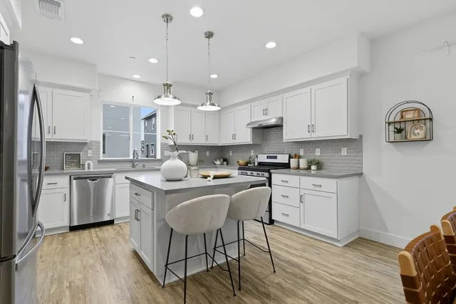 a spacious bedroom with a bed and a couch