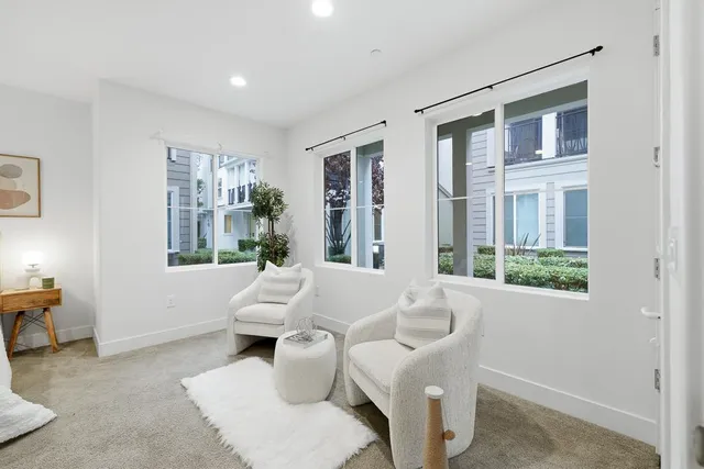 a white bath tub sitting next to a toilet