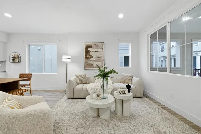 a kitchen with a table chairs sink and cabinets