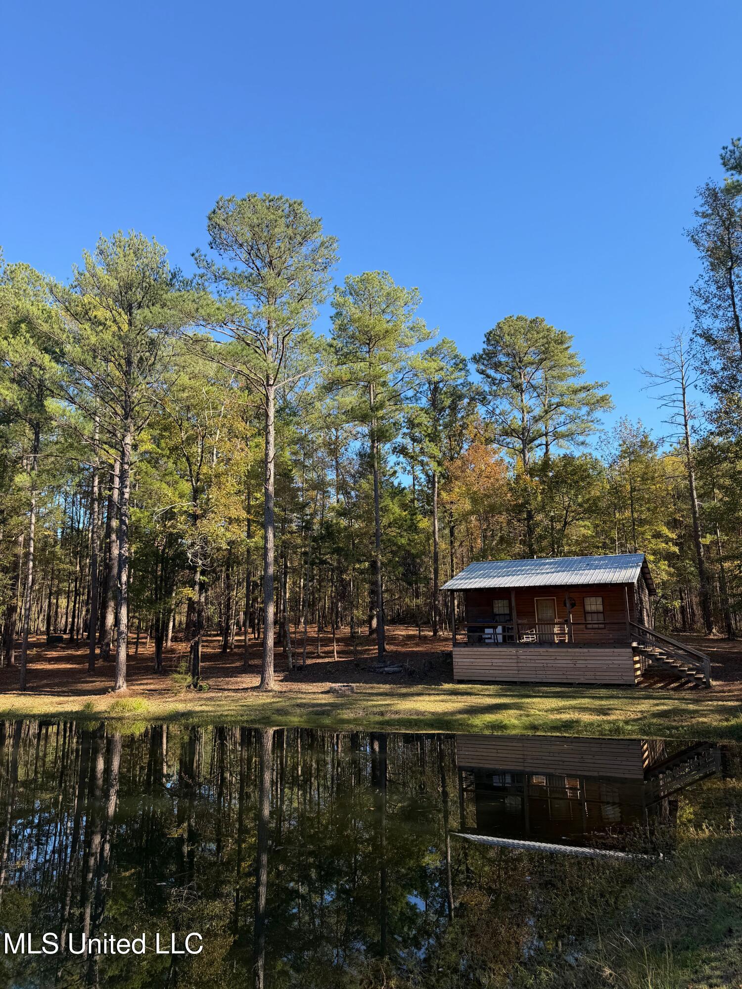 4348 Big Creek Road Sturgis, MS 39769 - Photo 1 of 23 Cabin Overlooking Pond