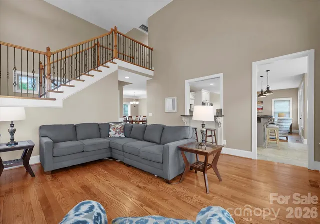 a view of a dining room with furniture wooden floor and chandelier