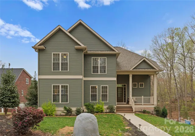 front view of a house with a yard