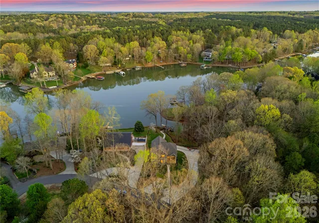 a kitchen with stainless steel appliances granite countertop a refrigerator sink and stove