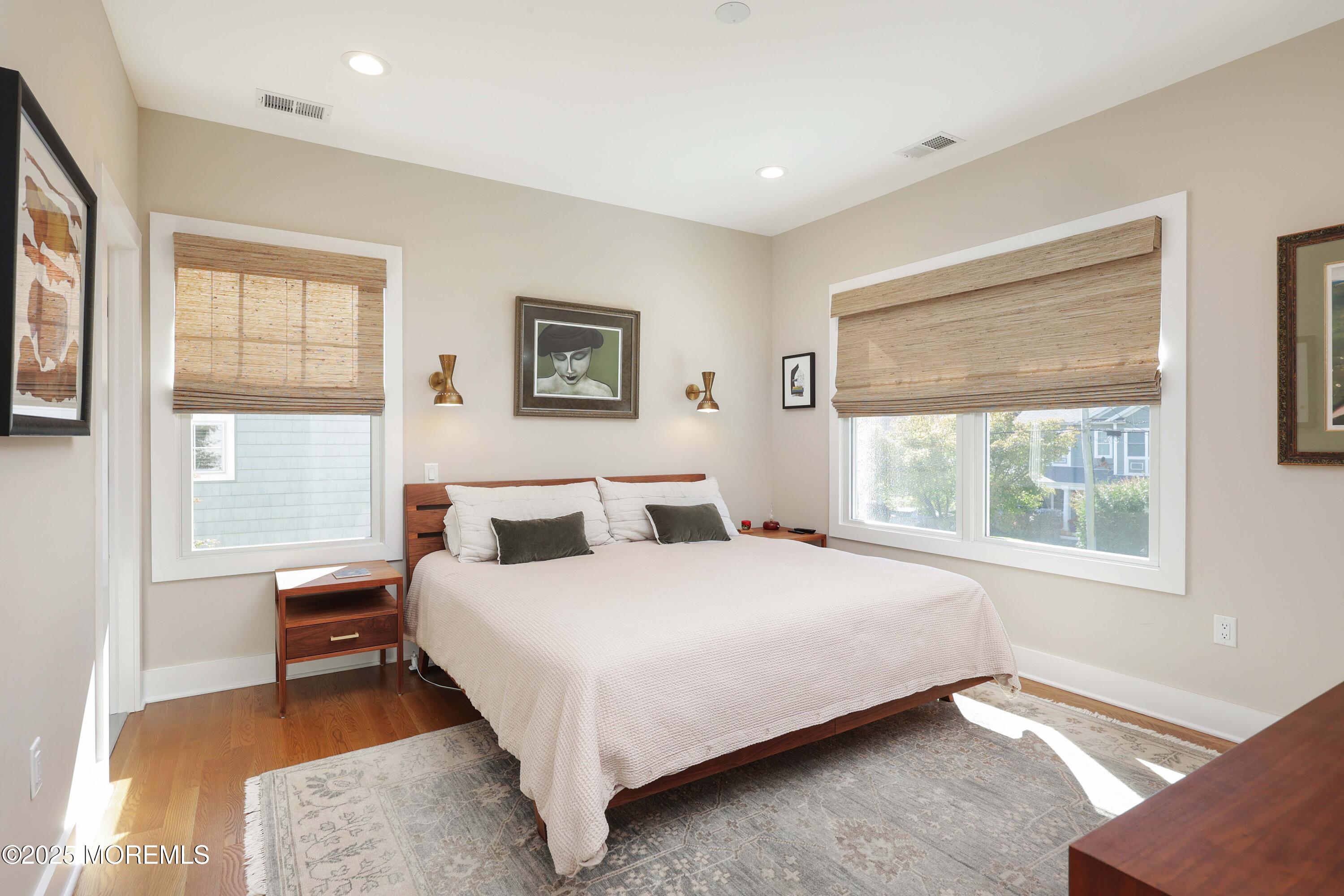 41 Forrest Avenue Rumson, NJ 07760 - Photo 12 of 32 a bedroom with a large bed and a window